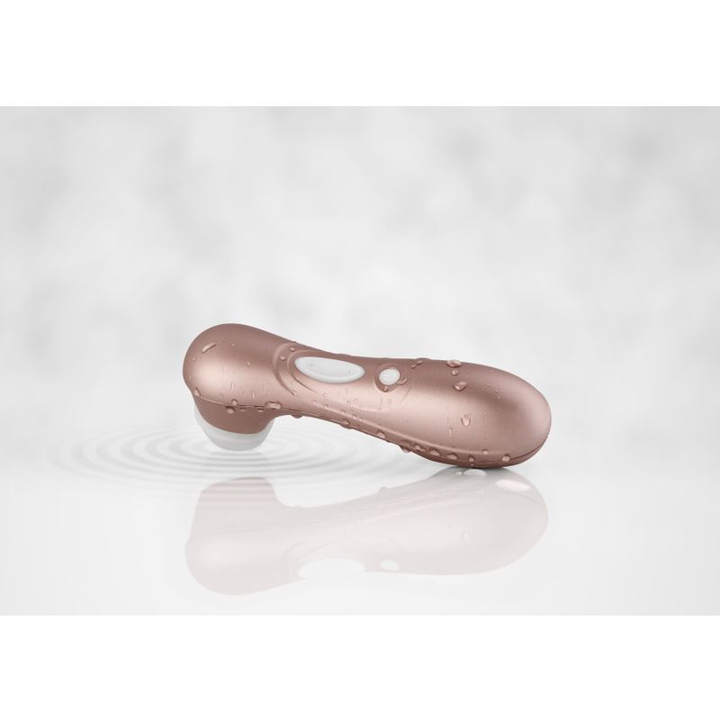 Satisfyer Pro 2 G2 Air Pulse Clitoral Stimulator Rose Gold with water drops on a reflective surface.