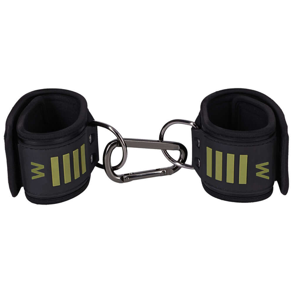 Fort Troff tactical bondage wrist cuffs in black and green with a metal D-ring for secure adjustments.