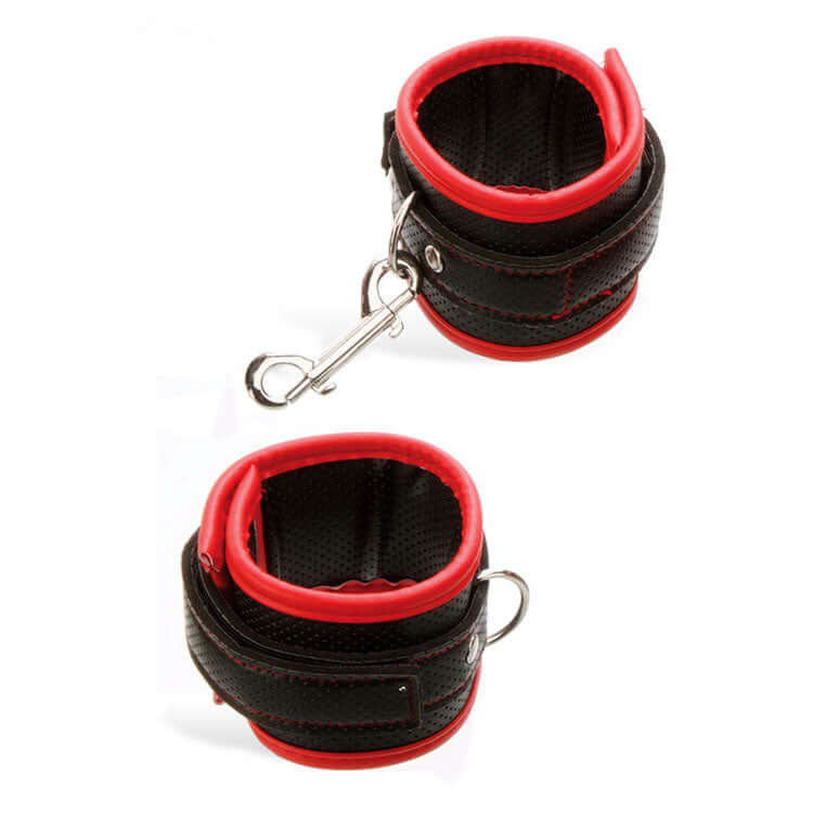 Adam & Eve SCARLET COUTURE vegan leather bondage cuffs with red trimming and detachable clasps.