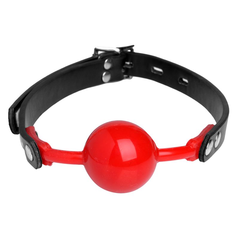Red silicone comfort ball gag with adjustable black strap for secure fit and comfort.