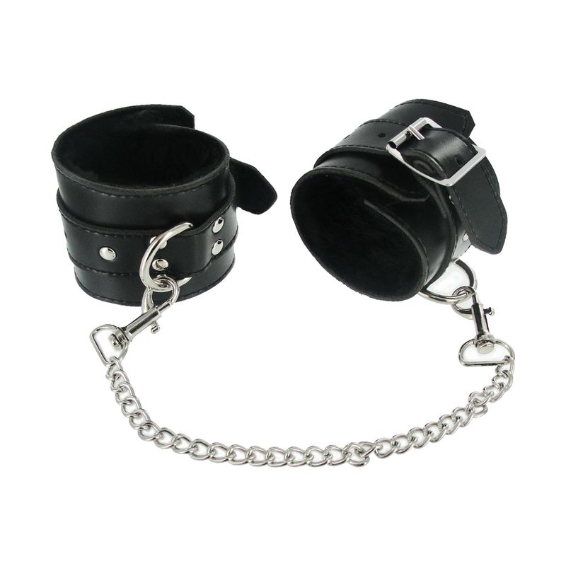 7 Pc Bondage Adventure Set black leather cuffs with chain for intimate essentials and adult entertainment.