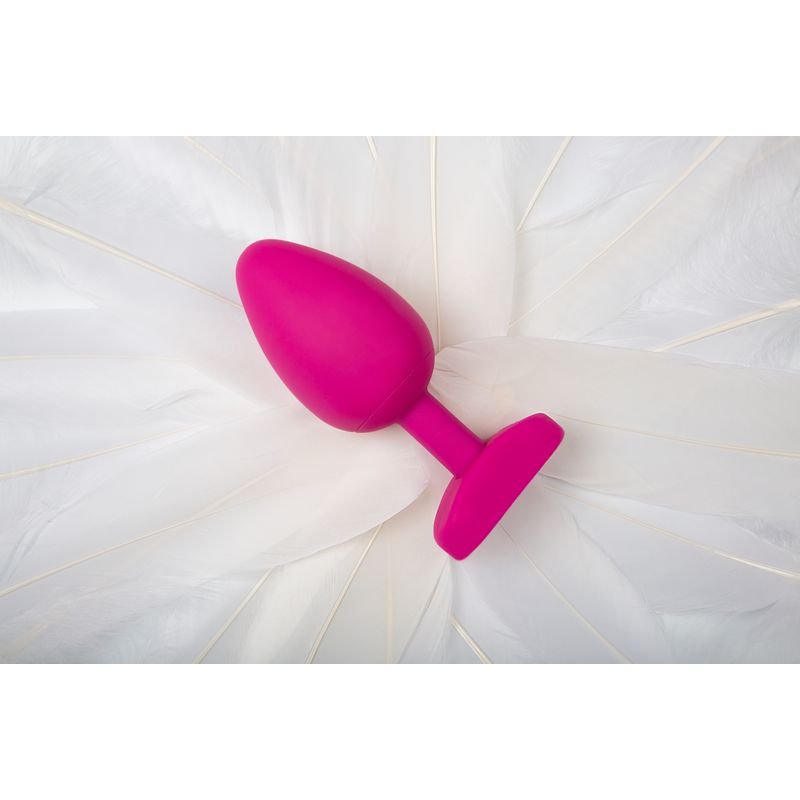 Gvibe Large Bioskin Sweet Raspberry bioskin sex toy raspberry on a soft white surface.