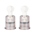 Nipple and clit suckers medium set of 2 with rotary pump for nipple enhancement, retail packaged.