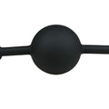 Silicone ball gag for bondage featuring a smooth black ball and adjustable straps for secure fit and control.