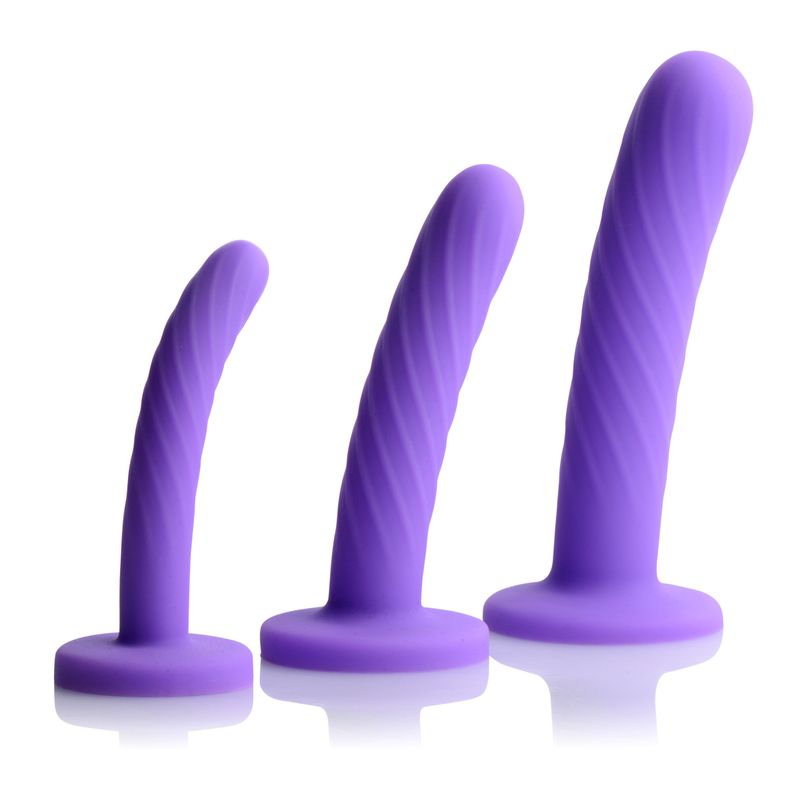 Tri-Play 3 Pc Purple Silicone Dildo Set showcasing three different sizes of smooth, textured purple dildos.