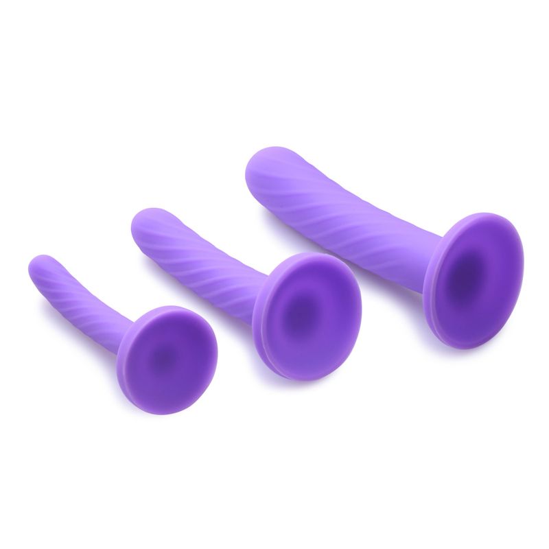 Tri-Play 3 Pc Purple Silicone Dildo Set featuring a trio of textured, purple silicone dildos in varying sizes.