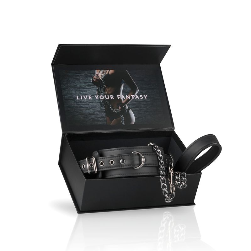 Fetish collar With Leash in an open box with the text 'LIVE YOUR FANTASY' on the inside.