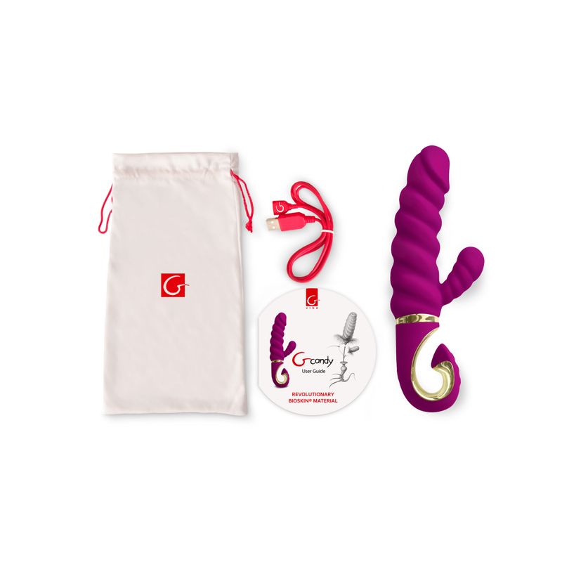 Gcandy Raspberry dual motor g-spot vibrator with charging cable and storage pouch in purple color.
