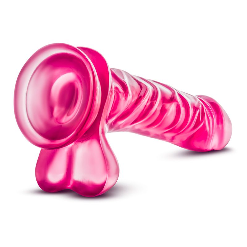 B Yours Basic 8 realistic dildo for beginners featuring a prominent head and textured shaft in vibrant pink.