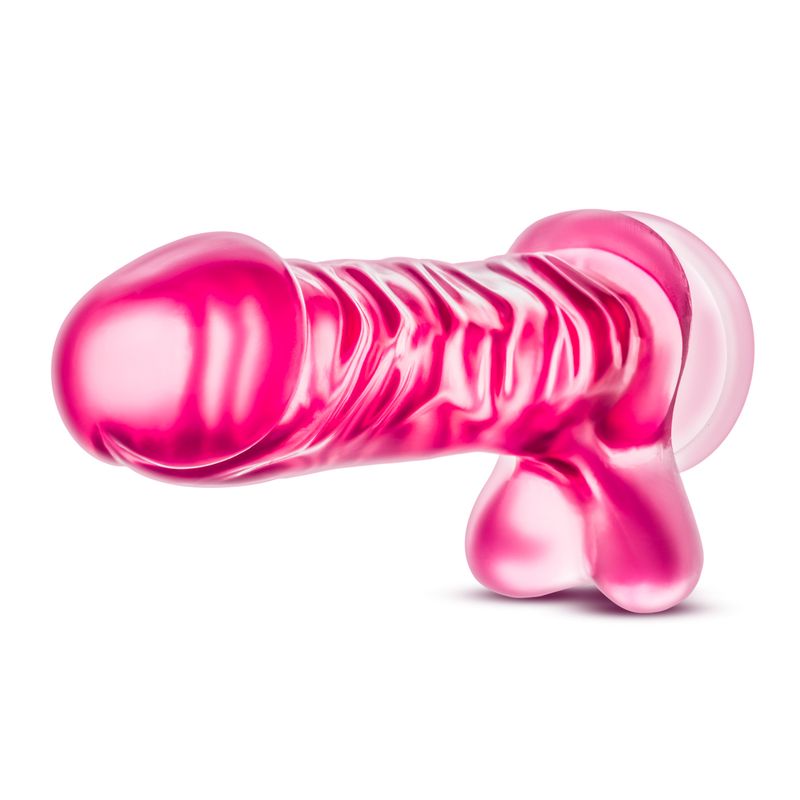 Realistic dildo for beginners in pink color, 9 inches long, with a prominent head and textured design.