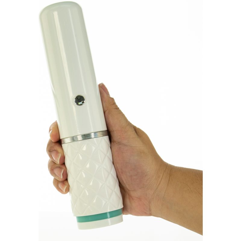 Pillow Talk thrusting vibrator held in hand, featuring stylish diamond pattern handle and sleek design.