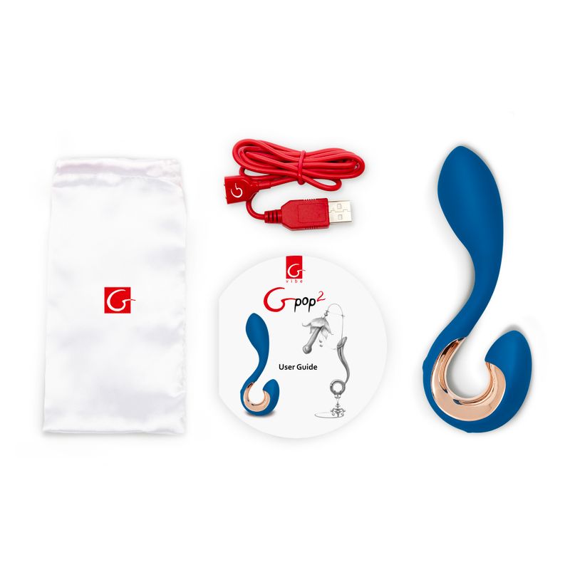 Gpop2 Indigo Blue unisex vibrator indigo blue, user guide, and charging cable on a white background.