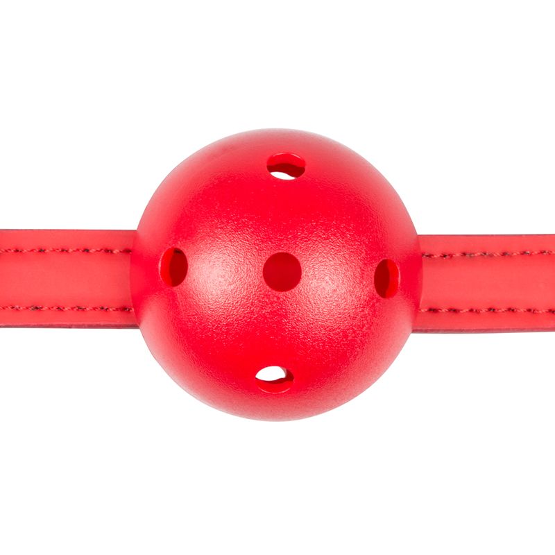 Red PVC ball gag for bondage with adjustable faux leather strap for pleasure and control.