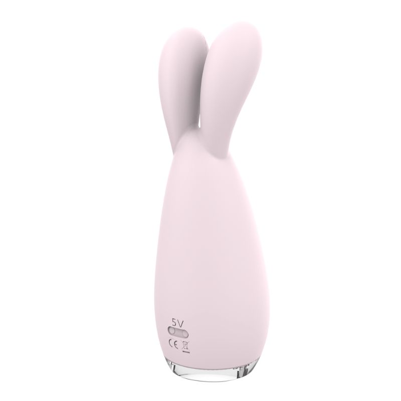 Reba Massager Orchid dual vibrating massager with flexible heads and USB magnetic charger.