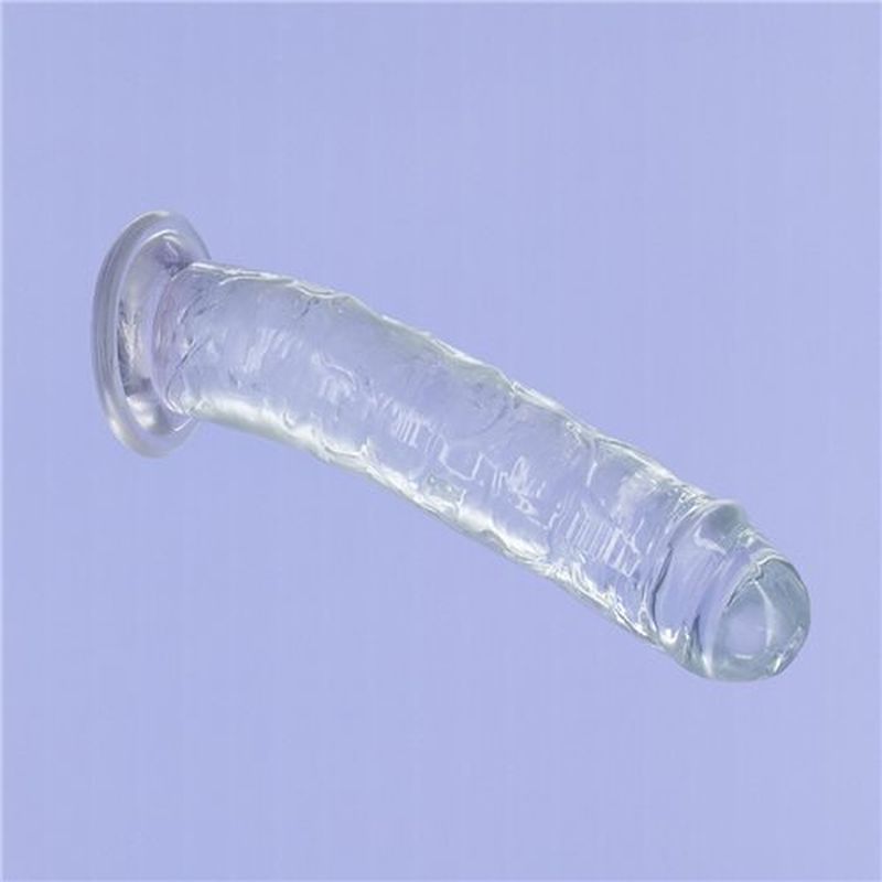 9 inch clear crystal dildo on a light background, featuring a lifelike design and strong suction base.