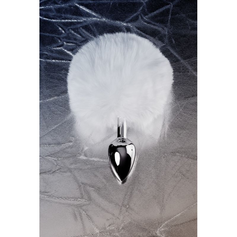 Small bunny tail anal plug with fluffy faux fur and silver metal design on a shiny background.