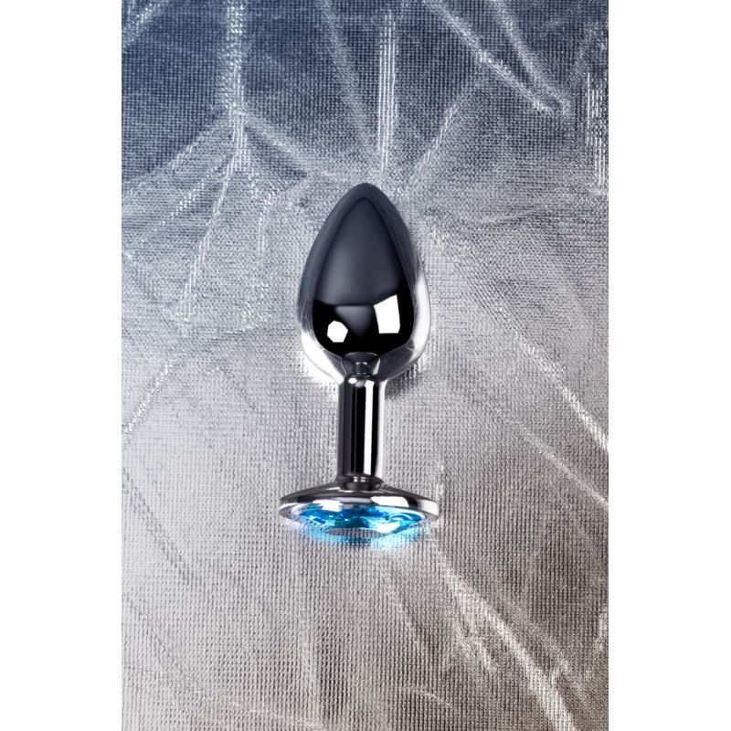 Silver Metal Anal Plug w Topaz Crystal Small displayed vertically on a textured background.