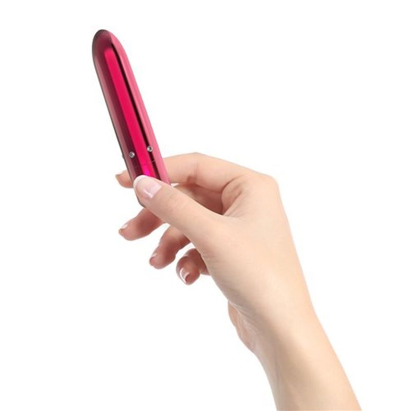 A hand holding the Pretty Point 4in Power Bullet Pink, a luxurious bullet vibrator with powerful features.