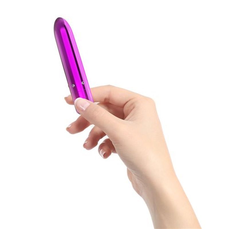 Hand holding a luxurious purple bullet vibrator, showcasing its sleek design and glamorous appeal. Perfect luxury bullet vibrator.