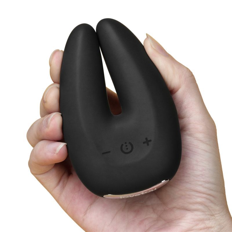 O Sensual Rapture Dual Motor Clit Massager Vibrator in hand, showcasing its sleek design and controls for customized pleasure.