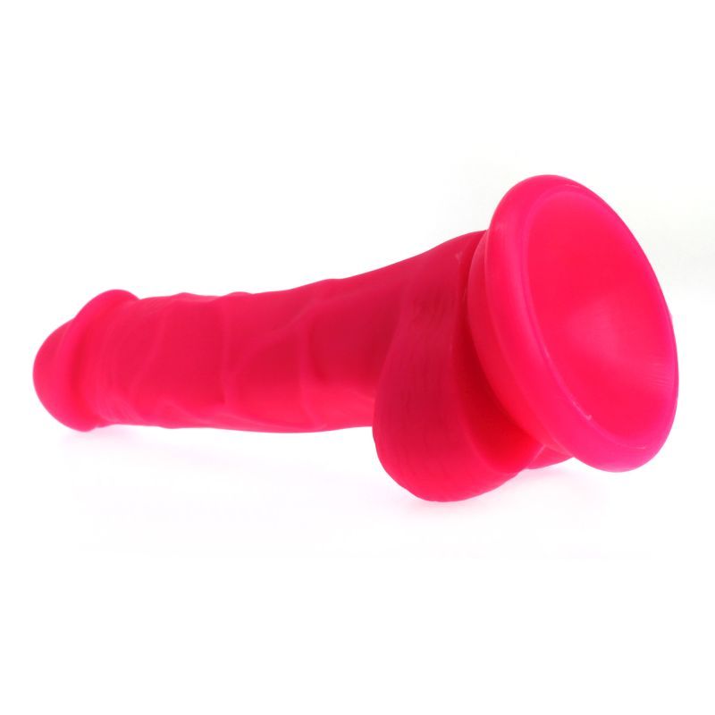 Realistic pink dildo with veined shaft on a suction base, 17cm long and made of 100% silicone.