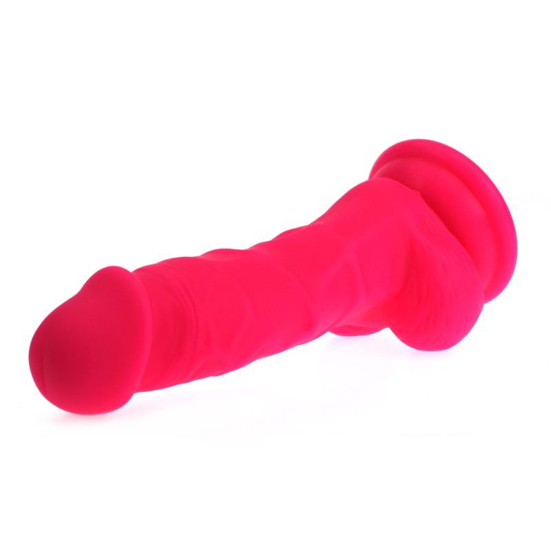Realistic pink dildo with veined shaft on a suction base, made of silicone, 17cm length, bright pink color.