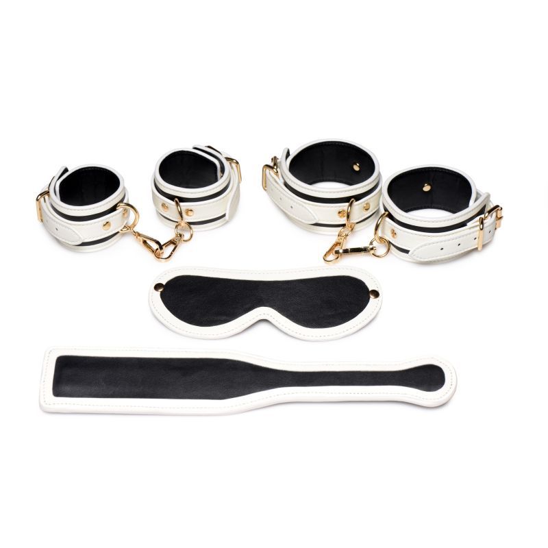 Kink In the Dark glowing bondage set featuring cuffs, paddle, and blindfold for adventurous play.
