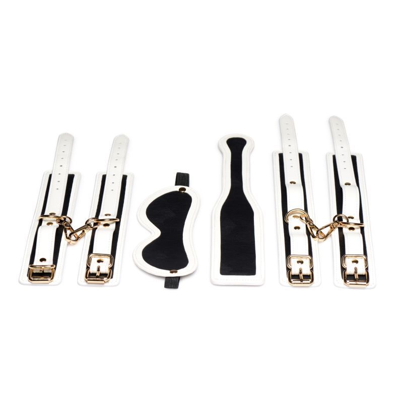 Kink In the Dark glowing bondage set including wrist cuffs, ankle cuffs, paddle, and blindfold.