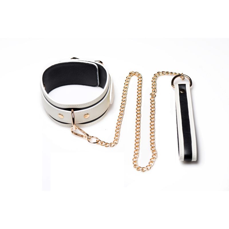Kink in the Dark glowing collar and lead set with a gold chain for elegant bondage activities.