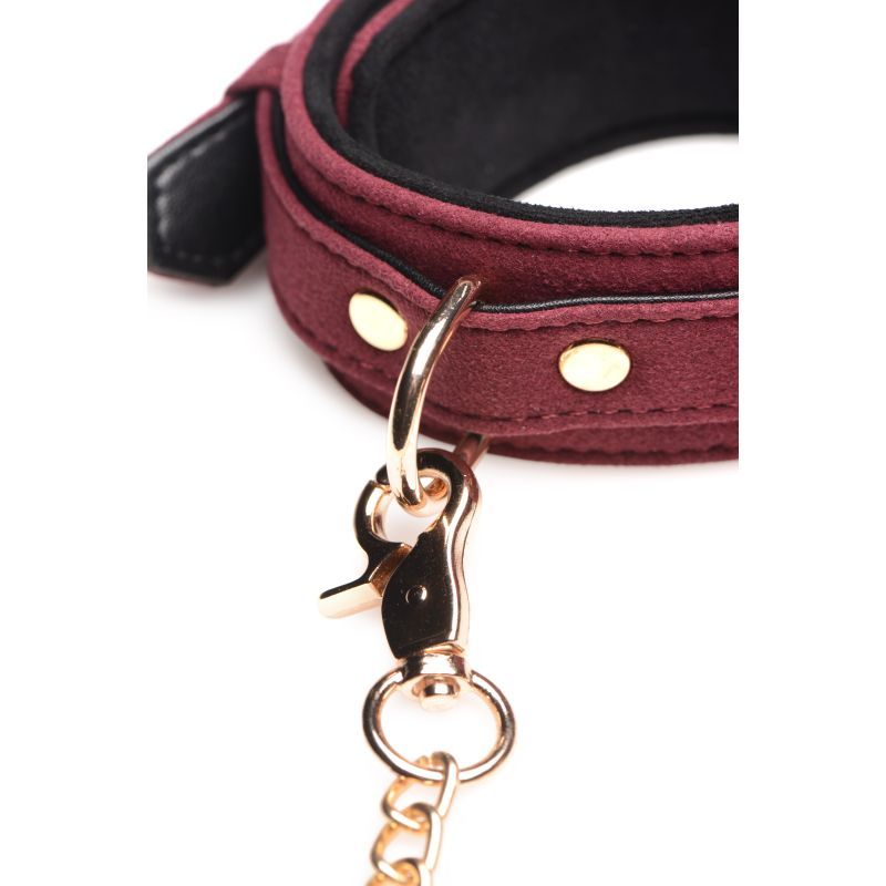 Close-up of the 6 Pc Velvet Bondage Set Burgundy with soft suede cuff and gold clip.