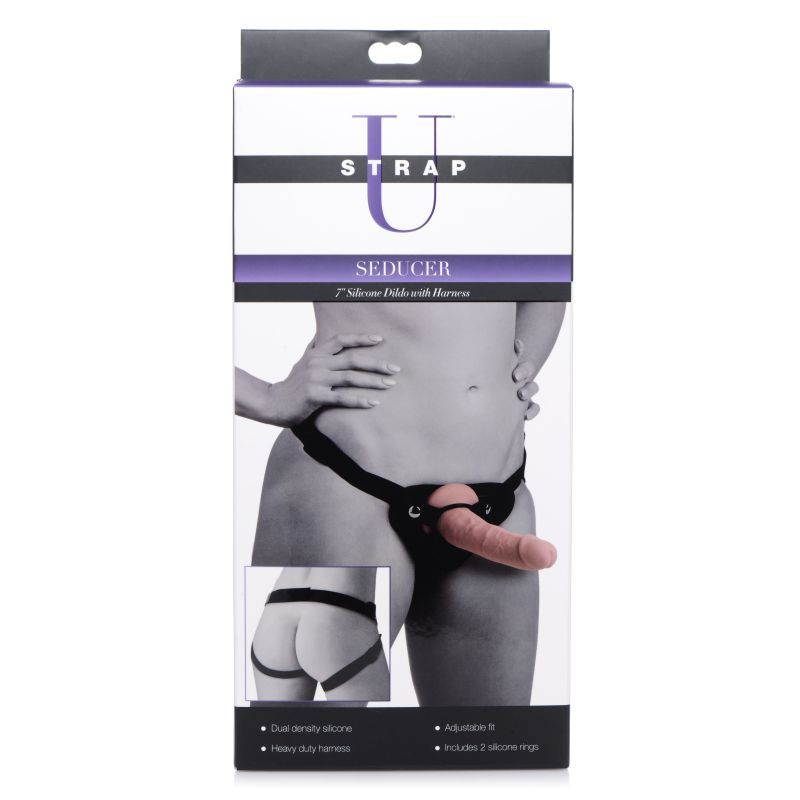 Seducer 7" silicone dildo harness set displayed on packaging with adjustable harness and dual density design.