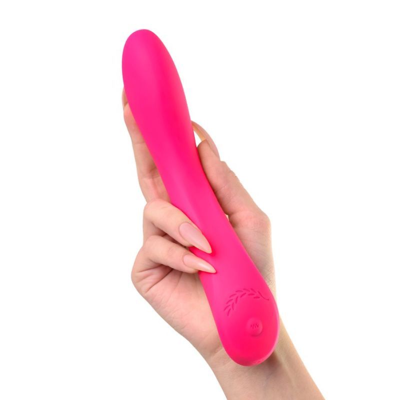 Hand holding the JOS Twig Slimline Vibrator, a G-spot silicone vibrator in vibrant pink, designed for deep orgasms.