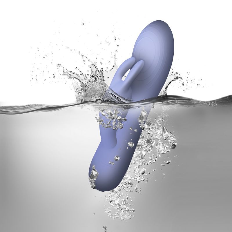 SugarBoo Blissful Boo Rabbit Vibe Lilac, a waterproof rabbit vibrator splashing in water, showcasing its design and features.