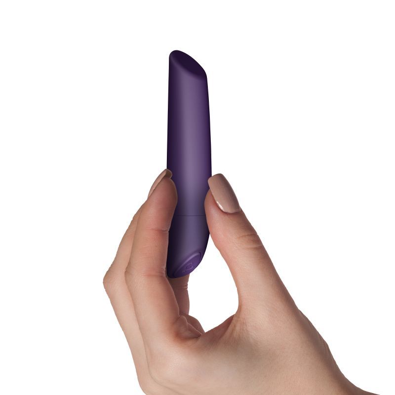 Hand holding the SugarBoo Damson Bullet Vibe Maroon, a wireless bullet vibrator maroon designed for targeted stimulation.