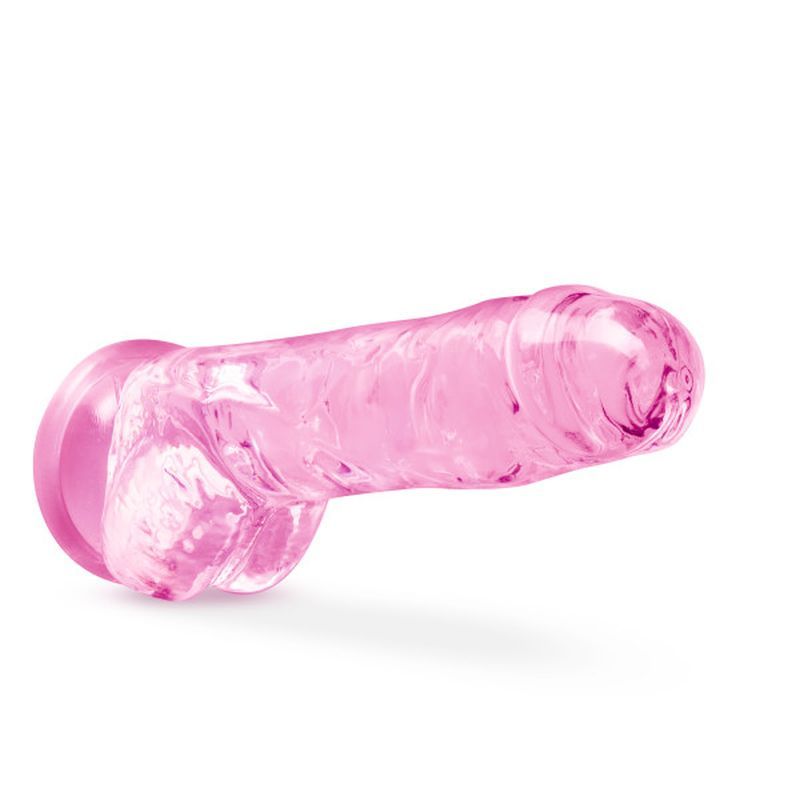 8 inch crystal dildo in a clear pink color, hand sculpted for a lifelike feel with a suction cup base.
