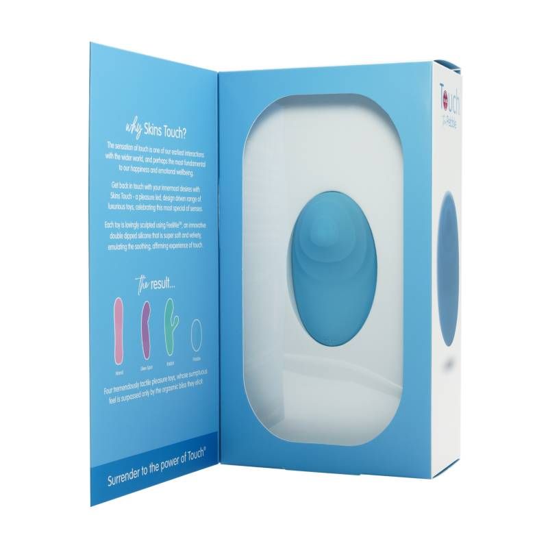 Skins Touch The Pebble external stimulation toy in packaging highlighting its ergonomic design.