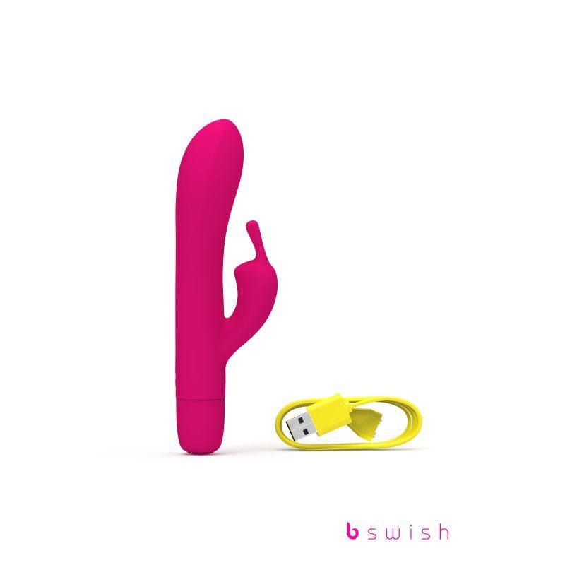 Bwild Bunny Classic Infinite Sunset Pink rechargeable rabbit vibrator with USB charging cable.