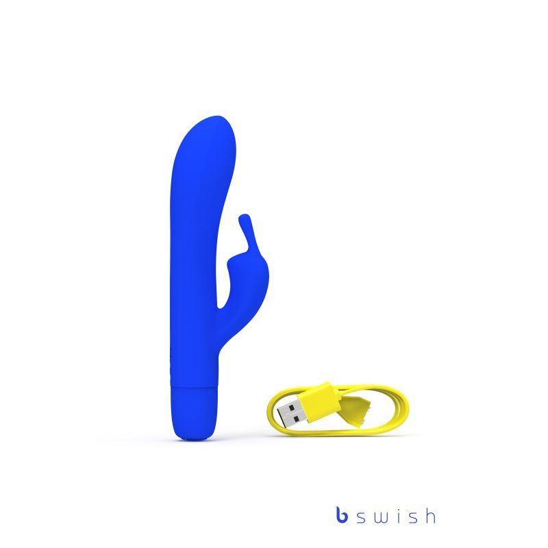 Bwild Bunny Classic Infinite Pacific Blue rechargeable waterproof rabbit vibrator with yellow USB charging cable.
