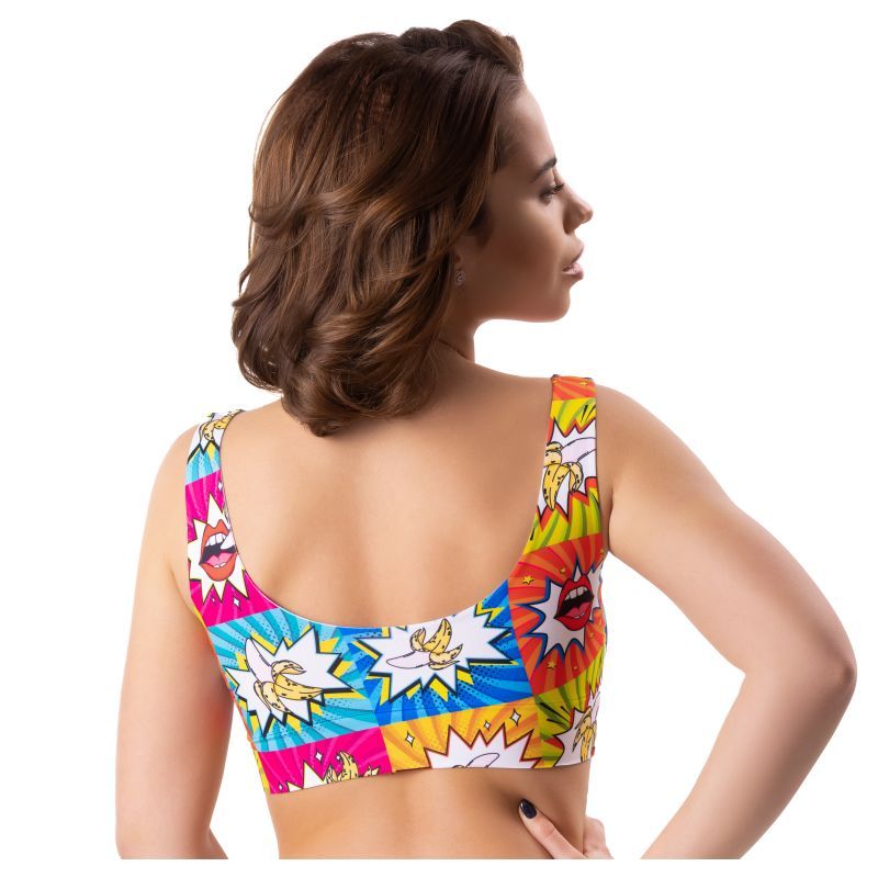 Back view of a woman wearing a colorful Comics Curios Crop Top lingerie featuring comic book designs.