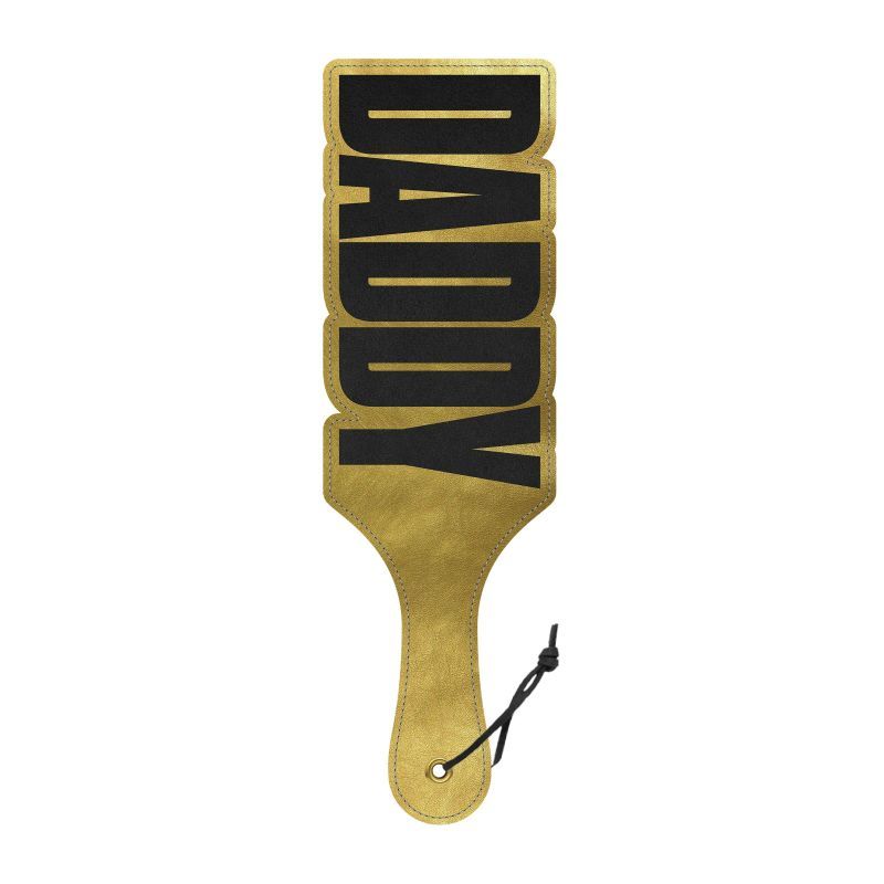 Designer spanking paddle with shimmering gold cut-out 'DADDY' design for naughty fun and stylish bedroom play.