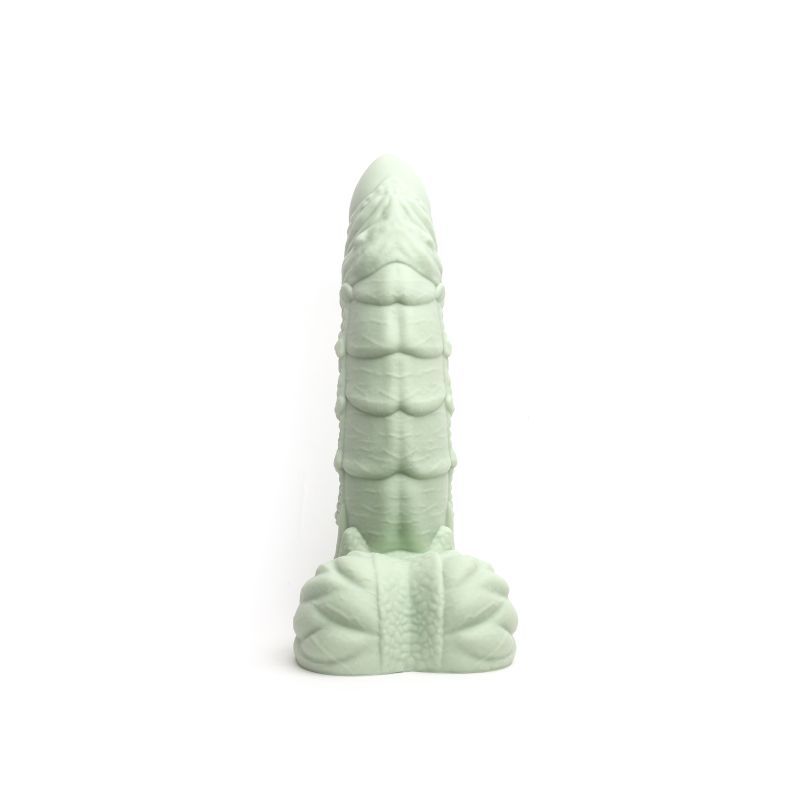 Willie liquid silicone dildo medium in soft green color, designed with detailed texture and balls.