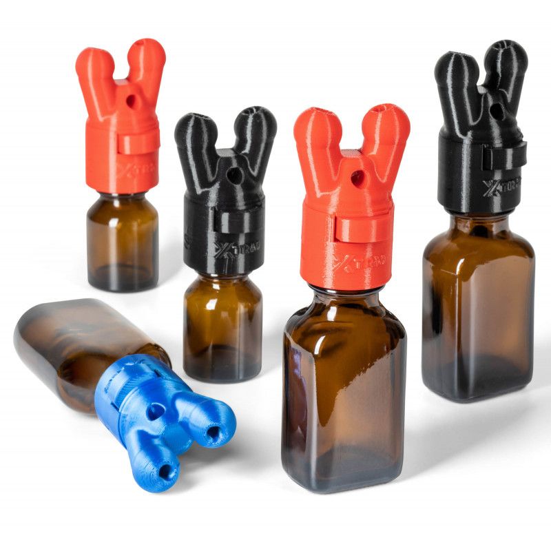 XTRM SNFFR Double Small Leakproof aroma dispenser, featuring various colored caps on amber bottles.