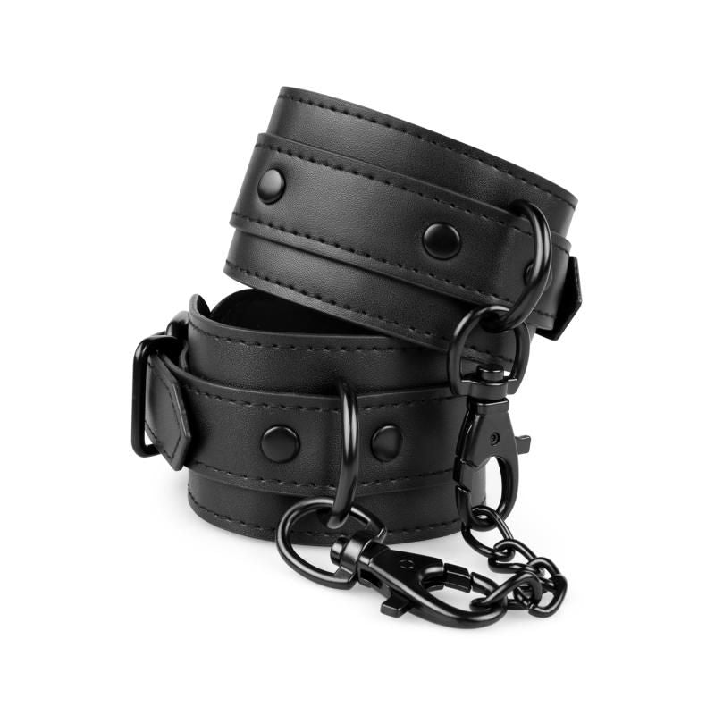 Pair of adjustable faux leather handcuffs in black with clip closures and chain, perfect for secure use.