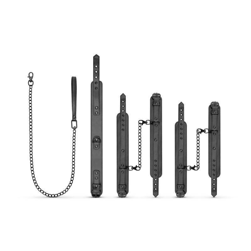 Total Restraint Complete Set Black featuring collar, leash, handcuffs, and ankle cuffs in synthetic leather.