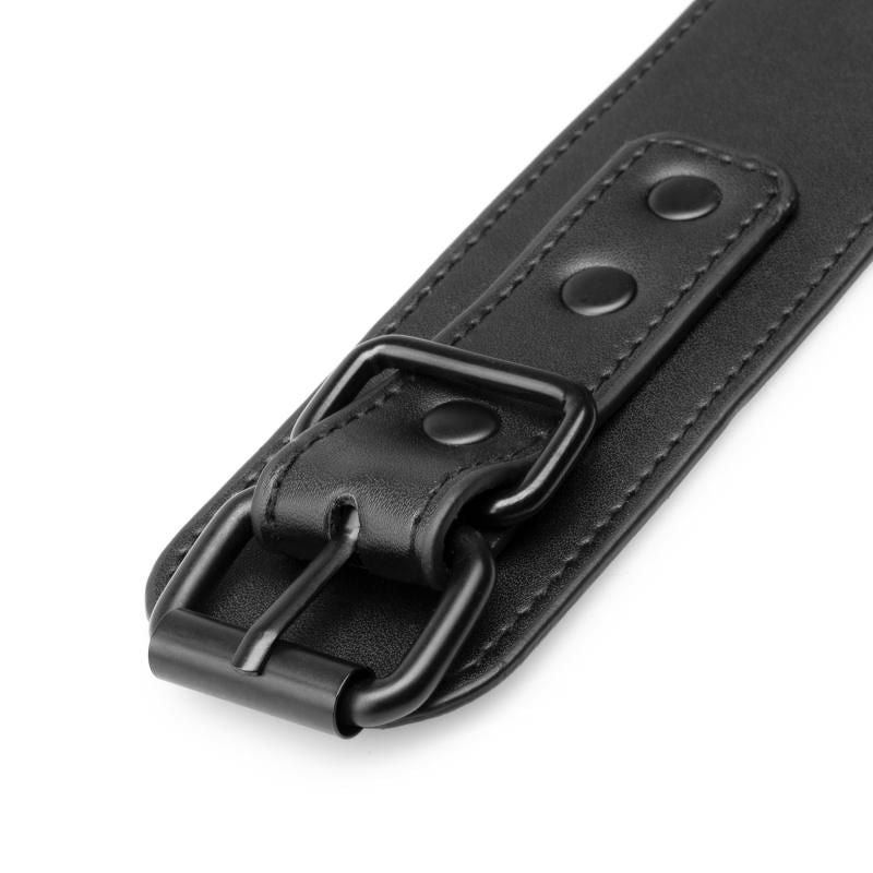 Close-up of leather strap with buckle from the Total Restraint Complete Set Black for BDSM and restraint play.