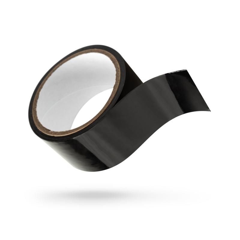 Bondage tape for role play in black, rolled and partially unspooled, perfect for exciting and safe fantasies.
