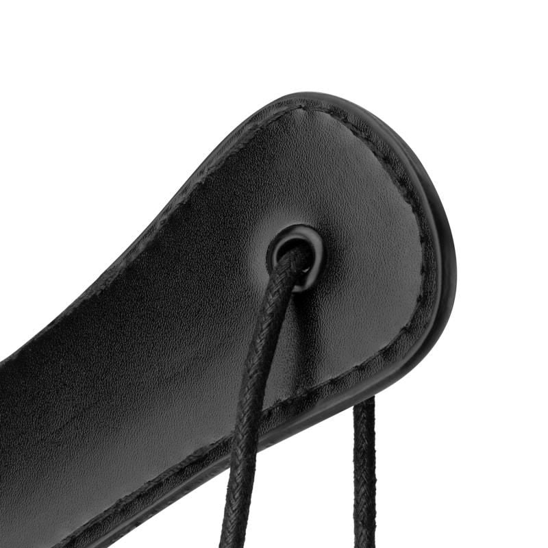 Close-up of the Faux Leather Paddle Black showing its smooth surface and lacing for grip detail.