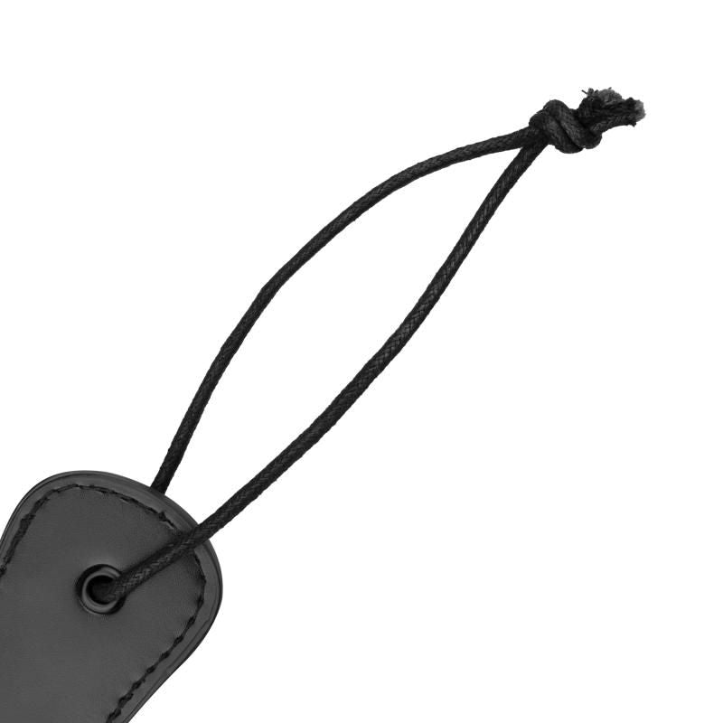 Faux Leather Paddle Black with a durable grip and hanging strap for exciting BDSM play.
