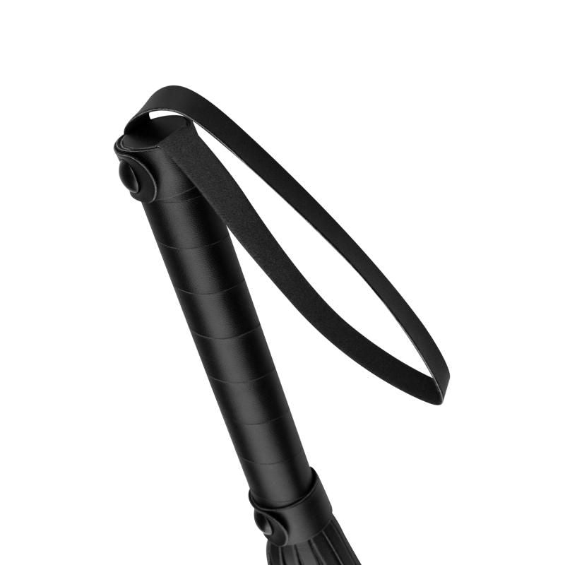 Close-up of the handle and loop of a Faux Leather Flogger Black, perfect for BDSM play and intimate essentials.