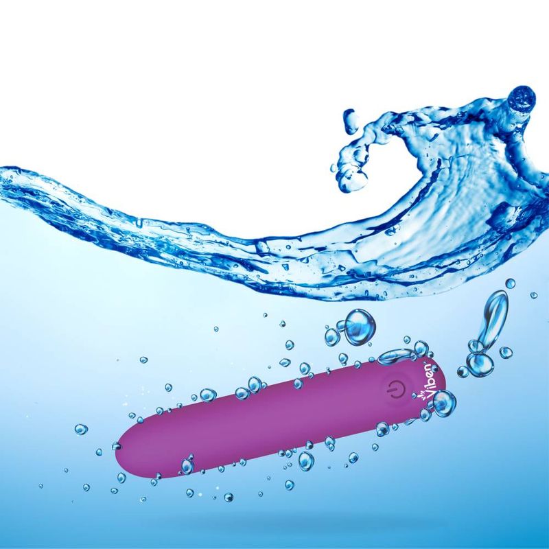 USB rechargeable bullet vibrator surrounded by water, showcasing its waterproof design and sleek silicone finish.